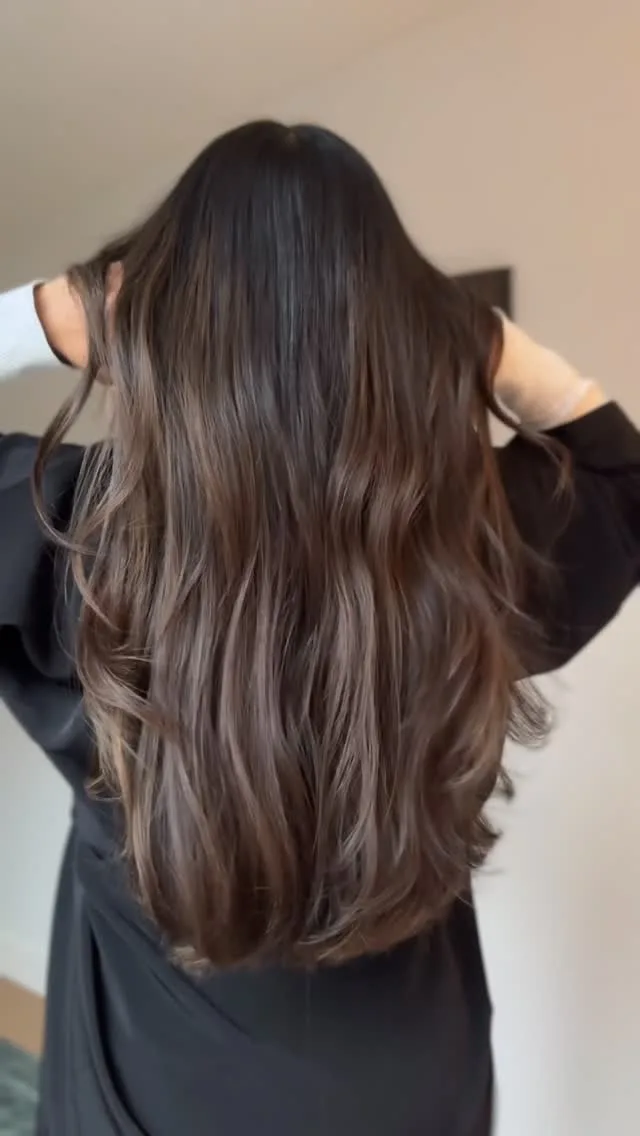 Long brunette balayage seen from behind